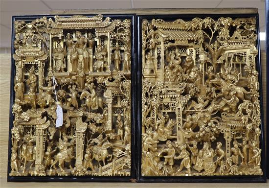 A pair of Chinese carved and gilded wood panels, signed, each 33 x 44cm